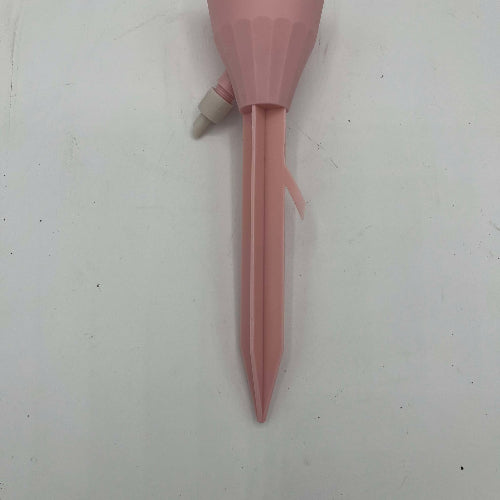 arrosoir gouttes à gouttes rose vu de face